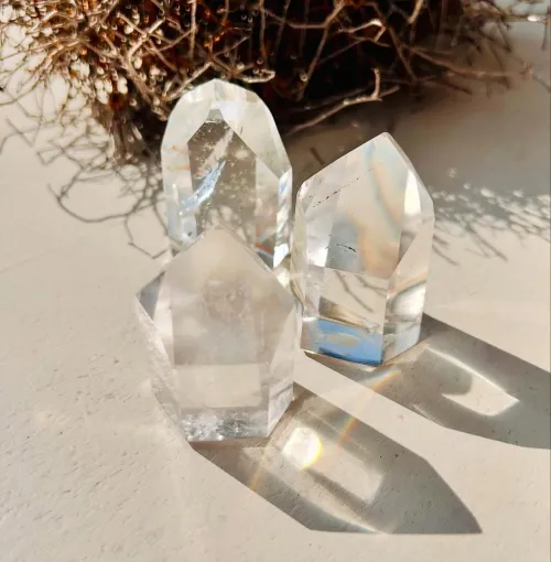 Clear quartz cluster showing hexagonal structure and natural inclusions