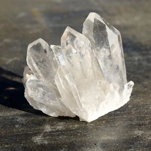Comparison of clear quartz clusters showing different clarity levels