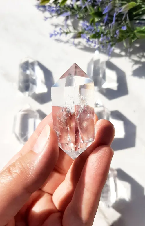 Hand holding quartz over protective cloth