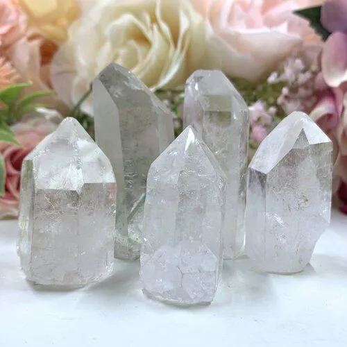 Hand wiping clear quartz crystal with soft cloth