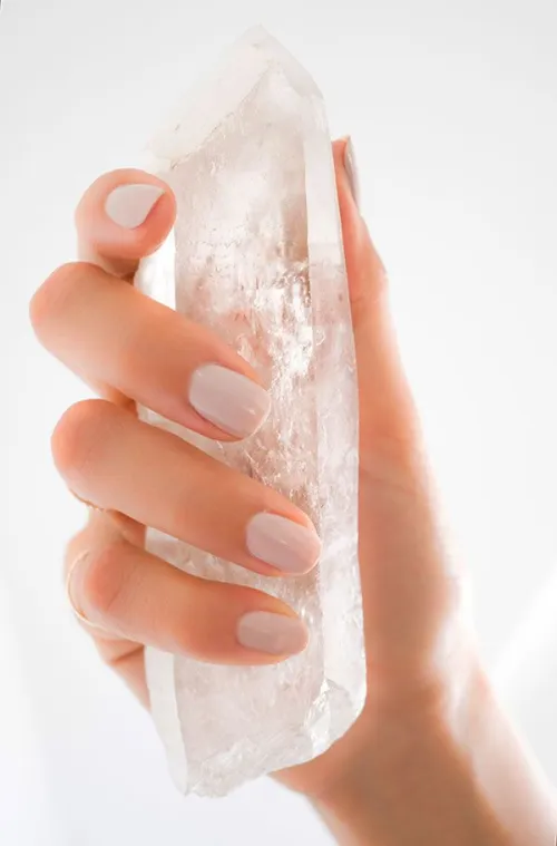 Rainbow light refraction patterns in clear quartz prism