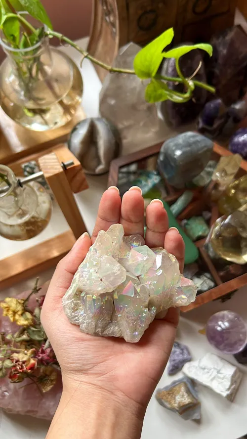 Person using clear quartz during meditation for calming sensory experience