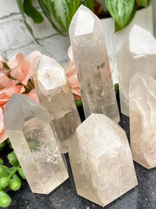 Natural clear quartz specimen showing internal inclusions and light refraction